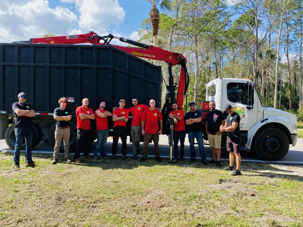 The Action Tree Care crew standing in front of a crane truck
